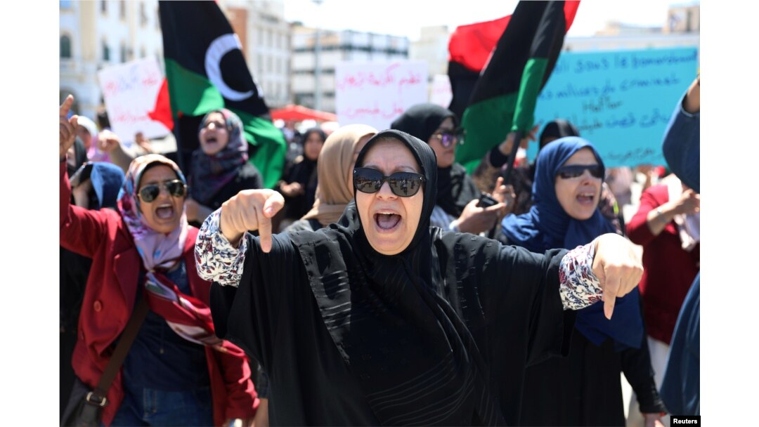 Libyan women shout slogans during a demonstration to demand an end to the Khalifa Haftar's offensive against Tripoli, at Martyrs' Square in Tripoli, Libya, April 17, 2019.