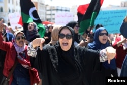 Libyan women shout slogans during a demonstration to demand an end to the Khalifa Haftar's offensive against Tripoli, at Martyrs' Square in Tripoli, Libya, April 17, 2019.