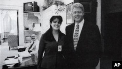 FILE - Official White House photo from page 3179 of Independent Counsel Kenneth Starr's report on President Clinton, showing the president and Monica Lewinsky at the White House, taken Nov. 17, 1995.
