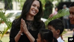 FILE - Hollywood actress Angelina Jolie smiles before a press conference in Siem Reap province, Cambodia, Feb. 18, 2017. 