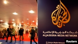 FILE - The logo of Al Jazeera Media Network is seen at the MIPTV, the International Television Programs Market, event in Cannes.