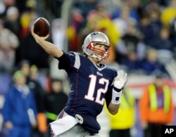 It is the quarterback's job to throw the ball. Here, New England Patriots quarterback Tom Brady throws during a game against the Indianapolis Colts, 2015. (AP Photo/Charles Krupa)