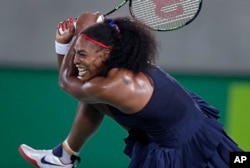 Serena Williams of the United States returns to Elina Svitolina of Ukraine at the 2016 Summer Olympics in Rio de Janeiro, Brazil, Aug. 9, 2016.