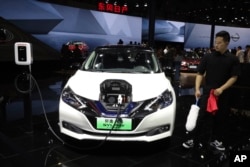 The Sylphy Zero Emission, an all-electric model designed for China is displayed at the Nissan booth during the Auto Shanghai 2019 show in Shanghai on Tuesday, April 16, 2019.