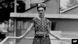 FILE - In this April 14, 1939 file photo, Mexican painter and surrealist Frida Kahlo poses at her home in Mexico City. 