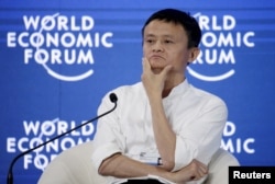 FILE - Chairman and chief executive of Alibaba Group Jack Ma reacts during a session of "Future-Proofing the Internet Economy" at the World Economic Forum (WEF) in China's port city Dalian, September 9, 2015.