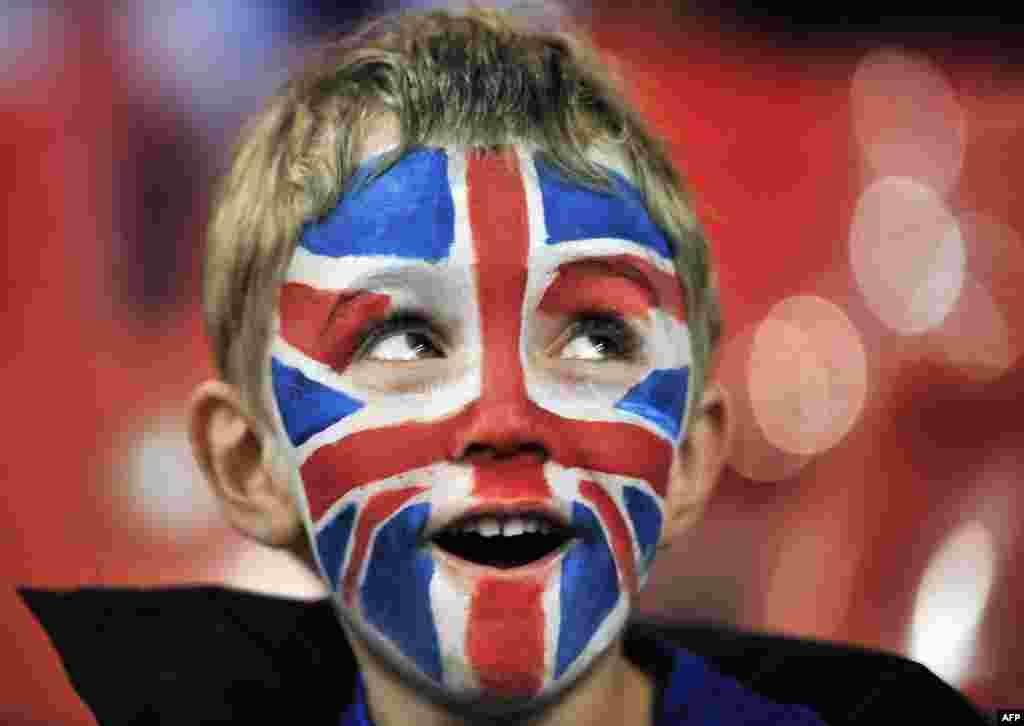 A young Great Britain fan enjoys the atmosphere before the London 2012 Olympic Games men's quarter-final football match between Great Britain and South Korea at the Millennium Stadium in Cardiff, Wales on August 4, 2012. 