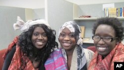 (From left) Rita Achiro, Ehklas Ahmed and Judith Abdalla sing in the Pihcintu Multicultural Children's Chorus.