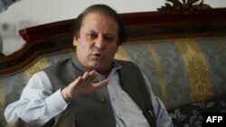 Pakistan's incoming prime minister Nawaz Sharif speaks to journalists at his farm house in Raiwind on the outskirts of Lahore, May 13, 2013. 