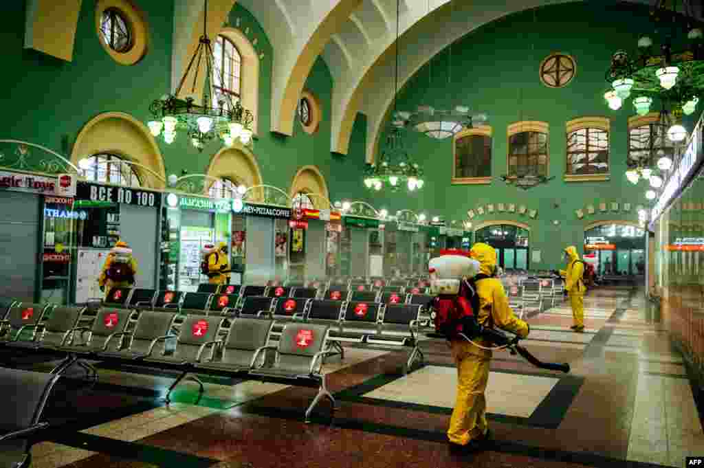 Servicemen of Russia&#39;s Emergencies Ministry wearing protective gear disinfect Moscow&#39;s Kazansky railway station, as the country adopts measures to curb the spread of the COVID-19. 