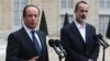 French President Francois Hollande, left, and head of the new Syrian National Coalition for Opposition and Revolutionary Forces Mouaz al-Khatib, right, when France recognized the rebel opposition in Paris, Nov. 17. (AP) 