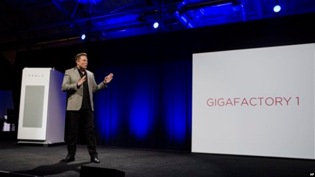 FILE - Elon Musk, CEO of Tesla Motors, unveils the company’s Powerpack, in Hawthorne, California, April 30, 2015. A 53-megawatt hour battery station will soon be providing power for the Hawaiian island of Kauai. 