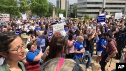 Protesters are seen gathered outside the state Capitol building on April 14, 2017, in Little Rock, Arkansas, to voice their opposition to the state's planned executions.