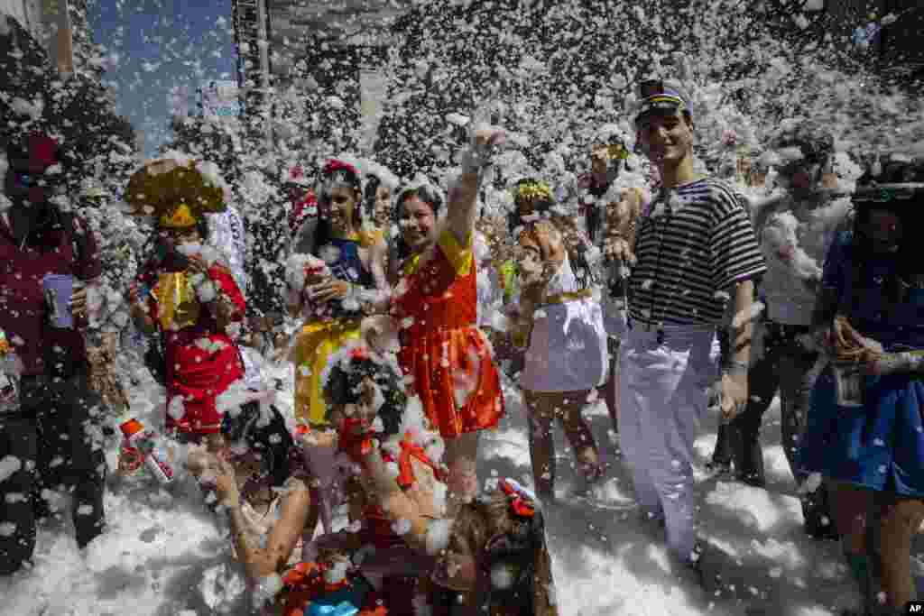 Medical school graduates dance during their class&#39; graduation parade in Rosario, Argentina.