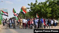 Sudanese anti-coup protesters attend a gathering in the capital Khartoum's twin city of Omdurman, Oct. 30, 2021, to express their support for the country's democratic transition which a military takeover and deadly crackdown derailed. 