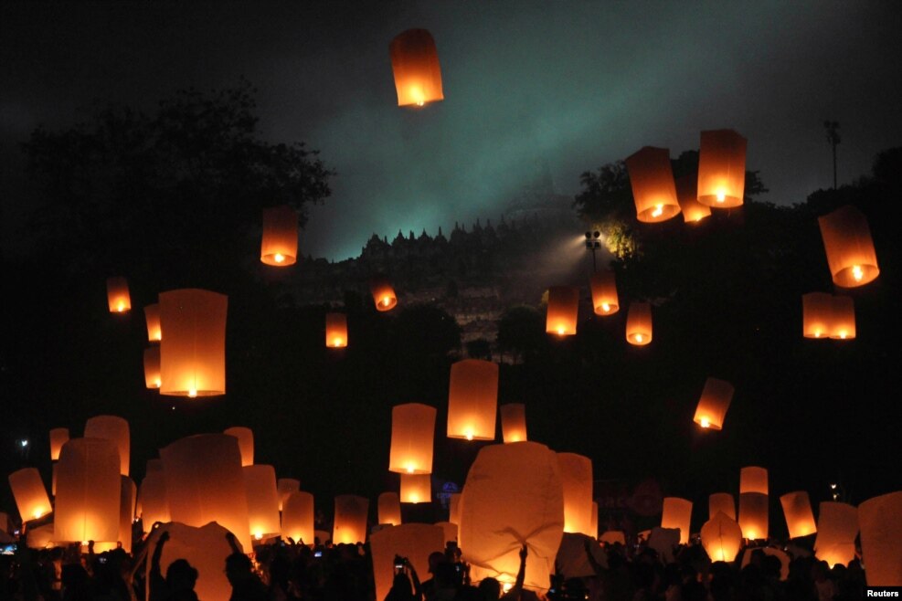 People release lanterns to mark the Buddhist celebration of Vesak at Borobudur temple in Magelang, Central Java, Indonesia, May 21, 2016, in this photo taken by Antara Foto.