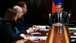 Russian Prime Minister Dmitry Medvedev chairs a government meeting on ways to shore up the plummeting ruble, Dec. 16, 2014. 