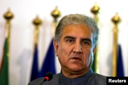 Pakistan's new Foreign Minister Shah Mehmood Qureshi listens during a news conference at the Foreign Ministry in Islamabad, Pakistan, Aug. 20, 2018.
