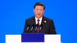 Chủ tịch Trung Quốc Tập Cận Bình phát biểu tại lễ khai mạc Hội chợ Nhập khẩu Quốc tế ở Thượng Hải hôm 5/11. Ông Tập cam kết mở cửa Trung Quốc nhiều hơn cho hàng nhập khẩu.