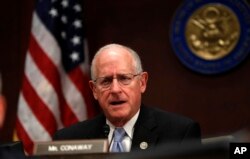 FILE - House Intelligence Committee member Rep. K. Michael Conaway, R-Texas, speaks on Capitol Hill in Washington.
