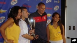 U.S. midfielder Jermaine Jones, with 'Man of the Match' trophy - He scored the first U.S. goal