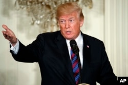 President Donald Trump speaks during a news conference with Baltic leaders in the East Room of the White House, April 3, 2018, in Washington.