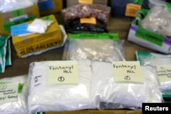 FILE - Plastic bags of fentanyl are displayed at the U.S. Customs and Border Protection area at the International Mail Facility at O'Hare International Airport in Chicago, Nov. 29, 2017.