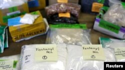 FILE - Plastic bags of fentanyl are displayed on a table at the U.S. Customs and Border Protection area at the International Mail Facility at O'Hare International Airport in Chicago, Illinois, Nov. 29, 2017. 