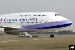 FILE - A China Airlines Boeing 747-400 sits on the tarmac at the Chiang Kai-shek International Airport in Taoyuan, Taiwan.