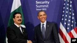 Pakistani Prime Minister Syed Yusuf Raza Gilani, left, and U.S. President Barack Obama smile during their bilateral meeting on the sidelines of the Nuclear Security Summit in Seoul, March 27, 2012. 