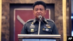 Thai police spokesman Prawut Thavornsiri speaks at a press conference at police headquarters, Bangkok, Thailand, Friday, Sept. 4, 2015. 