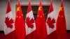 FILE - Canadian and Chinese flags are displayed at the Diaoyutai State Guesthouse in Beijing, Dec. 5, 2017. 