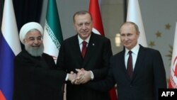 Les présidents iranien Hassan Rohani, turc Recep Tayyip Erdogan, et russe Vladimir Poutine, Ankara, Turquie, le 4 avril 2018.
