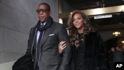 Recording artists Jay-Z and Beyonce arrive on the West Front of the Capitol in Washington, Jan. 21, 2013.