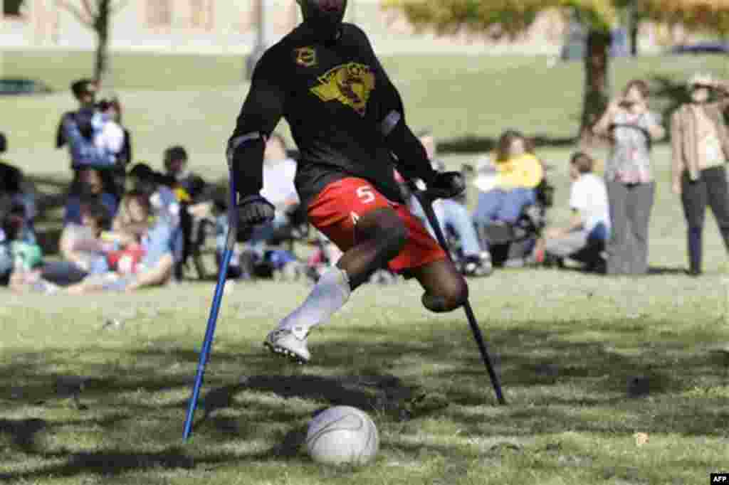 Francois MacKendy, a members of the Haitian National Amputee Soccer Team, plays in an exhibition match on the grounds of the Texas state capitol, Tuesday, Nov. 16, 2010 in Austin, Texas. The team is touring throughout the country to raise support for ampu