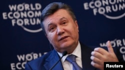 FILE - Ukraine's President Viktor Yanukovich addresses delegates during the annual meeting of World Economic Forum in Davos, Switzerland, Jan. 24, 2013.