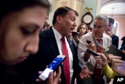 FILE - Sen. Mike Rounds (Republican-South Dakota) speaks to reporters on Capitol Hill, in Washington, July 20, 2017.