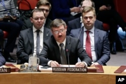 Acting Russia ambassador Petr Iliichev, center, delivers remarks to the U.N. Security Council in New York, Feb. 21, 2017.