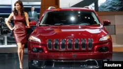 FILE - A Jeep Cherokee on display at an auto show.