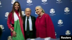 President of Italian Golf Federation Franco Chimenti (center) poses with Italian designer Laura Biagiotti (right) and her daughter, Lavinia, in Rome, Dec. 16, 2015.