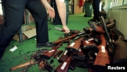 FILE - Guns are stacked after they were handed over on the last day of the Australian gun buy-back scheme in Sydney, Sept. 30, 1997. Al Jazeera recently reported that Australia's One Nation party sought money from the NRA to weaken gun laws.