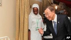 U.N. Secretary-General Ban Ki-moon talks to a patient in a hospital in Abuja, Nigeria (File Photo)