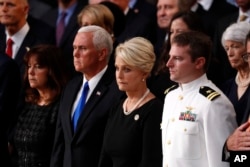 Cindy McCain, center, stands with Vice President Mike Pence and Jack McCain, right, during a ceremony as the casket of Sen. John McCain lies in state at the Rotunda of the U.S. Capitol in Washington, Aug. 31, 2018.