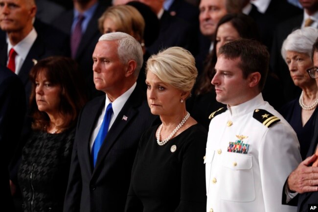 Cindy McCain, center, stands with Vice President Mike Pence and Jack McCain, right, during a ceremony as the casket of Sen. John McCain lies in state at the Rotunda of the U.S. Capitol in Washington, Aug. 31, 2018.