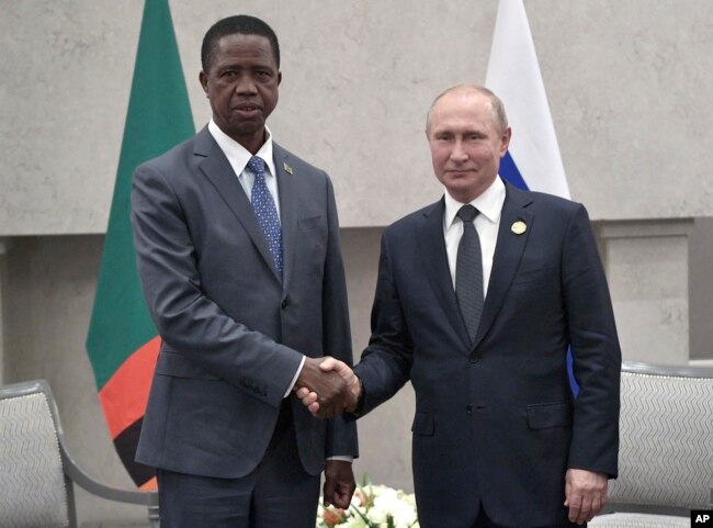 President Edgar Chagwa Lungu of Zambia, left, and Russia's President Vladimir Putin pose for a photo at the BRICS summit in Johannesburg, South Africa, July 26, 2018.