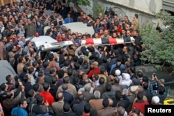 Relatives, friends and other mourners attend the funeral of Shaimaa al-Sabbagh, an activist at the Socialist Popular Alliance Party, during her funeral in Alexandria, Egypt, January 25, 2015.