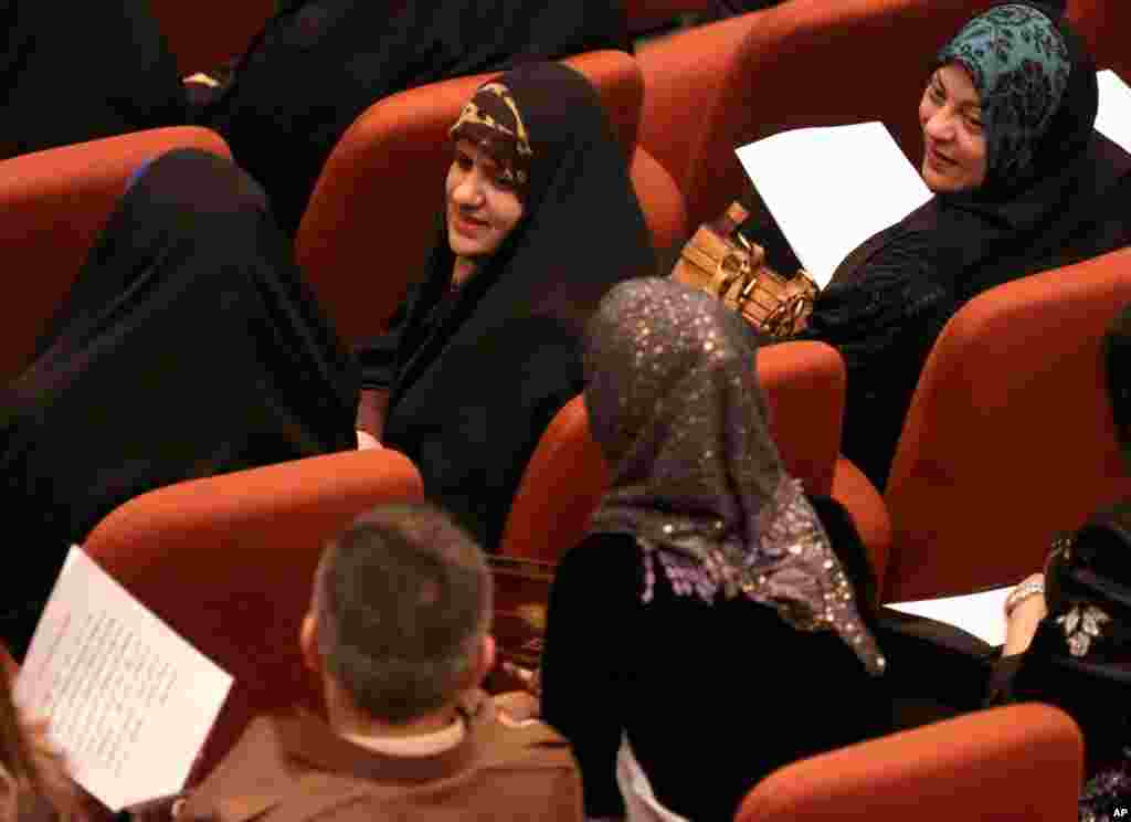 Newly elected Iraqi parliament members attend the first session of parliament in the heavily fortified Green Zone in Baghdad, July 1, 2014.