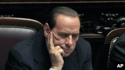 Italy's Prime Minister Silvio Berlusconi attends a debate at the Parliament in Rome October 13, 2011