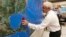 National Oceanic and Atmospheric Administration public affairs officer Dennis Feltgen updates the progress of Hurricane Michael on a large map, Oct. 9, 2018, at the Hurricane Center in Miami. 