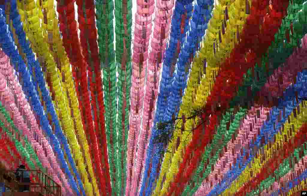 A worker checks lanterns in preparation for the upcoming celebration of Buddha&#39;s birthday at the Jogye temple in Seoul, South Korea.